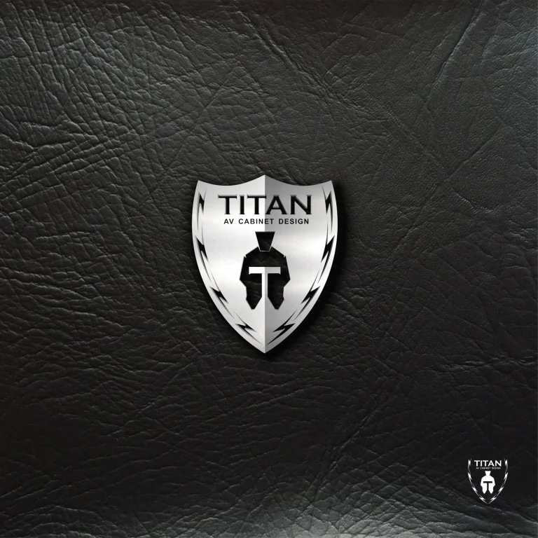 Метално лого във формата на щит с шлем и надпис TITAN AV CABINET DESIGN върху текстурирана черна кожена повърхност.