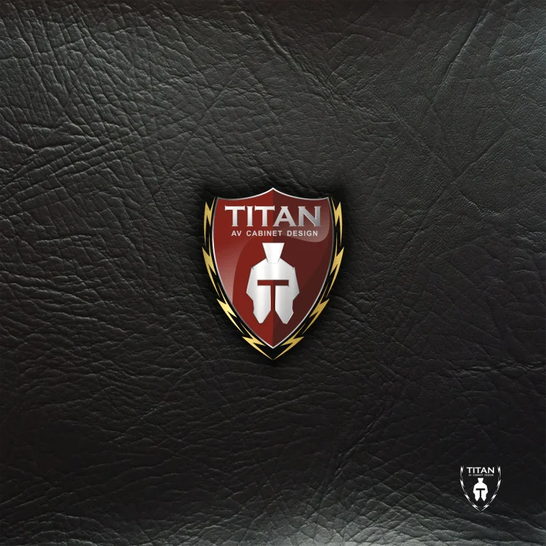 Графичен дизайн на лого във формата на щит с шлем и надпис TITAN AV CABINET DESIGN върху текстуриран черен фон.